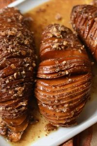 This easy Hasselback Sweet Potatoes recipe is made with maple syrup and pecans. Simple to make for Thanksgiving dinner as an alternative to sweet potato casserole. It may look fancy, but it's a quick-to-prep Southern side dish.