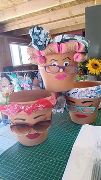 Each pot has it's own personality.  I hand paint them using acrylic paint.