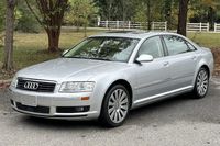 This 2005 Audi A8L was registered with one owner in California before it was acquired by the seller on BaT in July 2024, and it has 52k miles. The car is finished in Light Silver Metallic over Cream Beige Valcona leather upholstery, and it is powered by a 4.2-liter V8 linked with a six-speed Tiptronic automatic transaxle and Quattro all-wheel drive. Equipment includes the Cold Weather and Convenience packages as well as a solar sunroof, xenon headlights, 19″ 12-spoke alloy wheels, an air susp...