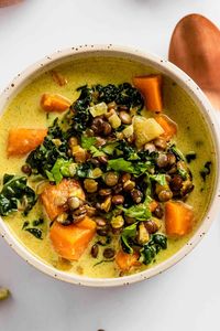 Thick and hearty Sweet Potato Lentil Stew is packed with good-for-you ingredients: delicious sweet potatoes, coconut milk, kale, and lentils! This lentil stew is incredibly filling and true comfort food in one bowl. Vegan, Dairy-free, Gluten-Free.