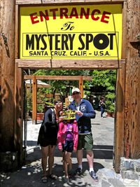 Humorous family photo at the Mystery Spot attraction in Santa Cruz, California | Things to do with kids in the San Francisco Bay Area