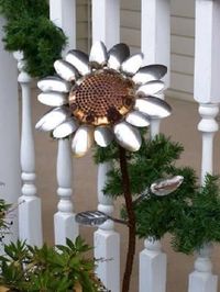 Old shower head and spoons turned sunflower!