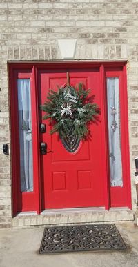 wreath made in a snowflake pattern with faux evergreens