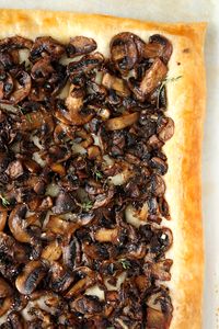 This simple, savory mushroom and parmesan tart is made with mushrooms, sautéed until browned and crispy, a little garlic, parmesan, and fresh thyme. Perfect for Mother's Day brunch, your next holiday party, or lunch with the girls.