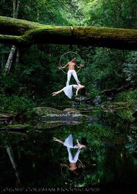 Float. Photographer says, "2nd in the series with Emma Goh and Steven Watson, a couple of brilliant aerialists that I shot recently in a rainforest close to where I live. Yes she is actually just lying across his feet suspended in mid air. These two were just so graceful. I was thrilled that I could get the reflection as well--fortuitously slowly flowing creek that day."