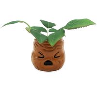 Officially licensed Harry Potter Mandrake indoor ceramic planter with faux succulent plant makes a statement! This cool planter features a sculpted 3D pot resemble a Mandrake's face with a artificial succulent plant coming out of the top. Planter measures 6-inches tall x 6-inches wide x 6.5-inches deep. Perfect for adding a touch of green on your shelf, desk table or centerpiece to show off your love for Harry Potter!