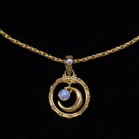 This Rainbow Moonstone gold moon necklace, handcrafted in 18K Gold Vermeil is designed in a Balinese style, adding a touch of exotic allure. The celestial necklace features a Moonstone crescent moon elegantly dangling in a Balinese-style hoop, accented by a smaller moonstone on the bail.  While the moon symbolizes feminine energy, emotions, and feelings, Rainbow Moonstones have been used in ancient rituals for their powerful healing properties. They are known to strengthen your intuition, provide protection, and attract love, making this Moonstone gold moon necklace not only a beautiful accessory but also a meaningful talisman. The Gold Vermeil moon necklace is individually packaged in my black Bluemoonstone Creations gift box with a description card, describing the spiritual and beneficia