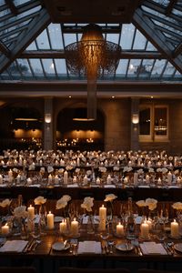 Candlelit wedding reception at Hampton Manor, Birmingham providing warm light and a romantic & intimate atmosphere. Taylor Hughes Photography.