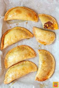 Puerto Rican meat pies, also known as baked empanadas, are a flavorful hand pie recipe with a ground beef, sofrito, and potato filling! You can make these easy savory pies with homemade empanada dough or use frozen Goya discos to simplify it even more. #SundaySupper #Empanadas #PuertoRicanFood #MeatPies #AppetizerRecipes #puertoricanrecipes #empanadasrecipe #empanada #beefempanadas #appetizers #handpies #meatpies #savorypies #pierecipe #easyrecipes #dinners #easydinners