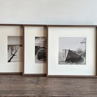 Framed Art This gorgeous sepia photography print of a beach, Jetty or Boat will be the perfect addition to your walls. The print is surrounded by a soft cream mount and a walnut colour frame. Overall Measurements: Width 41.5cm Height: 41.5cm