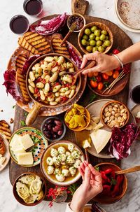 This Italian antipasto platter is a crowd-pleasing party appetizer! Guests will love snacking on this flavorful assortment of cheeses, olives, veggies, and more.