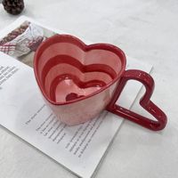 A gorgeous heart shaped hand painted cup. This rustic pink and red stripe mug is the perfect addition to your "cute cup collection," and will make a lovely coffee or herbal tea. The ceramic cutie is a good size, easy to hold with its heart shaped handle and is easy to care for being dishwasher safe. Product : Mug Quantity: 1 x Cup only Material: Ceramic Size: 300ml Easy to clean: Dishwasher safe Colours: Red., Light Pink We import this item from OUTSIDE of the U.K from a TRUSTED UK certified sup