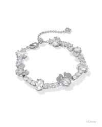 Celebrate joyful style and Disney fun with the Disney | Kendra Scott Silver Mickey Mouse and Minnie Mouse Tennis Bracelet in White Crystal. From the miniature iterations of Disney’s eternal sweethearts to its gorgeous crystal details, there’s so much to love about this timeless tennis bracelet. As elegant as it is whimsical, this wrist stack stunner will have you smiling ear to ear. Metal Rhodium Over Brass Material White CZ Closure Lobster Clasp W/ Single Adjustable Slider Bead Size 6.5"With 1.