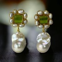 Show-Stopping Earrings for Weddings & Special Occasions Turn heads and steal the spotlight with our handcrafted, one-of-a-kind gemstone and pearl earrings. Designed to dazzle, these elegant earrings are perfect for weddings, formal events, or any occasion that calls for timeless beauty. Each earring features a stunning square-cut genuine gemstone encased in a luxurious 22k gold-plated brass bezel, surrounded by delicate genuine rice pearls. Available gemstones include: *Moonstone - ethereal shim