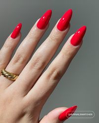 A bright cardinal red polish with a creme finish.