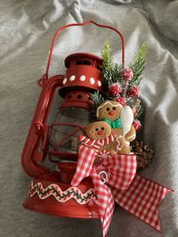 "This is for one red metal, Gingerbread Themed Kerosene Lantern A real working kerosene lantern converted into a Country Decoration Decorated with puff paint, holiday greens and berries, two gingerbread ornaments and a gingham bow  Not meant to be used as a working lantern 11\" tall with handle extended ... 6\"  wide with decorations Visit my other Etsy shop https://www.etsy.com/shop/oldvintageporch NO RETURNS on my items unless damaged on route A photo must accompany requests for returns Buyer pays return shipping"