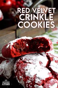 A delicious red cookie dough is rolled into powdered sugar to create these puffy, moist, Red Velvet Crinkle Cookies – the red and white lends itself well to holiday baking! #christmas #holiday #cookies #baking #red #velvet #redvelvet