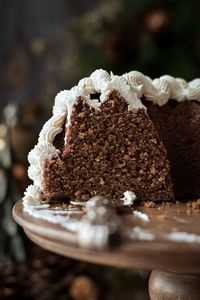 A high altitude tested recipe for gingerbread bundt cake.  This delicious holiday cake is dark, spicy and moist, and looks beautiful decorated with vanilla buttercream for Thanksgiving or Christmas.