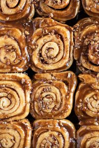 There is nothing better than the smell and taste of these Homemade Sticky Buns from Scratch! This sweet breakfast recipe combines a simple dough that's slathered in a buttery cinnamon sugar, and topped with an ooey-gooey caramelized pecan topping. They will melt in your mouth the minute you take that first bite! So, grab your 13 x 9 pan and let's get baking! | Makes 12 sticky buns | BeyondtheButter.com | #cinnamonrolls #stickybuns #breakfast #pecantopping #beyondthebutter