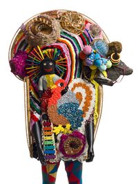 Nick Cave, who considers himself a humanitarian before an artist, created his first Soundsuit in 1992, after the appalling discharge of police officers involved with the Rodney King beating. Originally created as a sculptural costume, Cave discovered it rustled to movement when put on- each creating their own distinguishable noise. Reminiscent of African and Caribbean ceremonial garb as well as haute couture, Soundsuits examine themes of identity, transformation, ritual, and spiritual strength.