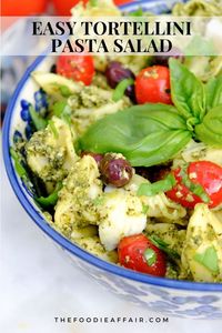 Mediterranean inspired fresh ingredients; cheese tortellini, kalamata olives, tomatoes, basil and homemade pesto sauce. Delicious side dish or appetizer idea. #SummerSalad #PastaSalad #EasyRecipe #Pesto #AppetizerIdea