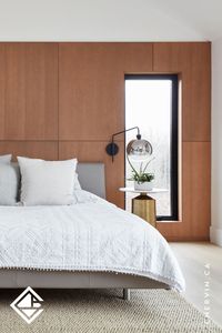 Transform your modern master bedroom with a striking flat panel accent wall crafted from vertical grain rift red oak. The rich texture and distinctive grain pattern of the rift oak create a visually captivating focal point, adding depth and sophistication to the room. This meticulously crafted accent wall enhances the contemporary aesthetic, bringing warmth and natural beauty to your personal sanctuary...#AccentWall #WoodWall #PanelledWall #PanelAccentWall #BedroomDesign #BedroomInspo