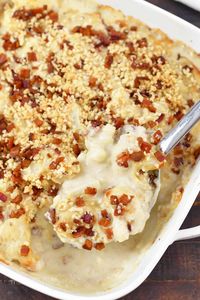 This comforting Cauliflower Casserole is creamy, cheesy, and has added bacon! It's the side that will be sure to satisfy everyone at the table. This side dish features cauliflower, bacon, cheesy sauce mixture, and topped with a bacon bread crumb topping.