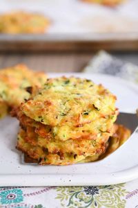 Simple and delicious, these baked cheesy zucchini bites are so easy to make and are a healthier alternative to a classic fried zucchini fritter! | melskitchencafe.com