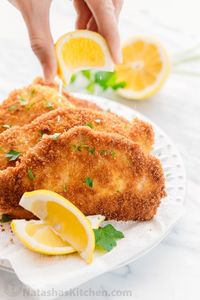 German Pork Schnitzel is an easy recipe, kid friendly and perfect for busy weeknights! Pork schnitzels are pork chops with a crispy crust and juicy center. | Natasha's Kitchen