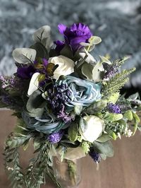 roses and other,fabulous bits and pieces..  Bride size Bouquet A forever keeps life like rose and lavender  Bouquet with artificialGreenery that will match any perfect bride! Matching halos, bridesmaids andCorsages to match in my store! Flowers, greenery and stems may change slightly