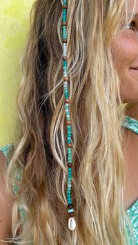 Clip-on hair extension made of beads and shells! Available in multiple color and length options.  Appearance may vary slightly from photos since each piece is custom-made with various beads.