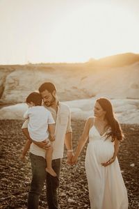 Outdoor beach sunset maternity family session with toddler boy photography ideas