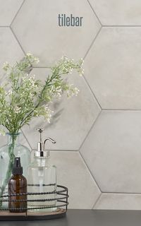 Create a soft and grounded look with Ava Gray Sabbia 8" Hex Matte Porcelain tiles. The matte finish and unique faces mimic hand-crafted tile's subtle tone variations. Perfect for contemporary design, the 8" hexagon format adds an extra creative touch. Elevate your space with the neutral gray shade, offering a fresh and modern urban vibe.