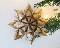 Don't throw away those empty toilet rolls! Learn how to repurpose them into Christmas toilet paper roll snowflakes ornaments.