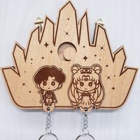 Made with love from a geeky home for yours - wood engraved Sailor Moon keyholder and couple keychain set! This one features original cute chibi fanart design of Queen Serenity and King Endymion with a Crystal Tokyo theme wall holder. Check out more designs available on my website ~