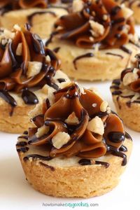 Mini shortbread cookie cups are topped with a swirl of soft Dulce de Leche caramel, a drizzle of dark chocolate, and a sprinkling of toffee bits. This is the easiest version of a Millionaire's Shortbread Cookie Recipe you'll ever make.