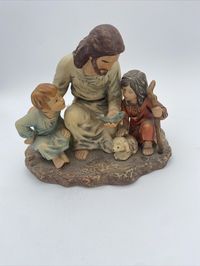 This vintage 1983 Homco Masterpiece figurine depicts The Fisherman Jesus and children in a beautiful porcelain material. The multicolor design is crafted with intricate details, making it a perfect addition to any room's decor. The figurine is unboxed and features a matte finish, with a subject of Jesus and a theme of religious children. Measures approximately 6.25x6” No chips or cracks Please zoom in on pics for further details