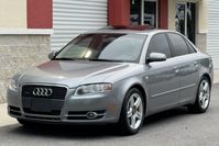 This Audi A4 has spent much of its time registered in Florida and is powered by a turbocharged 2.0-liter inline-four driving all four wheels through a six-speed manual transaxle. Finished in Quartz Grey Metallic over black leather upholstery, it is equipped with adaptive xenon headlights, fog lights, a power-operated sunroof, five-spoke 17" wheels, and an optional sport suspension with a lowered ride height. Other features include power-adjustable front seats, a Bose sound system, and dual-zo...