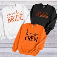 "Get ready to be OBSESSED with your new *Halloween Bachelorette* sweatshirt. It's the cutest and most trendy way to emit all those important spooky Halloween Bridal Party vibes!  Great as a Halloween Wedding Shower gift! * HOW TO ORDER * 1-) Please, check and review all photos. 2-) Choose your size and color. At personalization confirm what you want sweatshirt to say and color of letters. 3-) Click add to cart. You can go back to add more product 4-) Click \"Proceed to check out\" 5-) When you check out, you can add a note to seller for any request ✺ IF NO PERSONALIZATION GIVEN WILL BE SENT AS PER PICTURES  WHITE SWEATSHIRT - SPOOKY BRIDE BLACK SWEATSHIRT - MAID OF HORROR ORANGE SWEATSHIRT - BOO CREW ✺ Check out the tshirt version of this design here:  * Q U I C K * F A C T S * ✺ 50% cotto