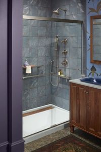 When designing a shower to accommodate multiple users, consider including a shower barre for safety and an adjustable-height handshower for convenience.