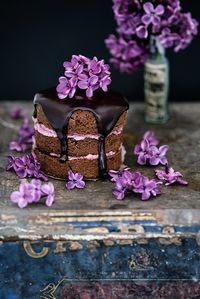 Mini Chocolate Almond Cakes with Blackberry Buttercream and Chocolate Glaze - an easy and ultra chocolatey cake that keeps really well. Using my vintage props for styling with dark and moody food photo.