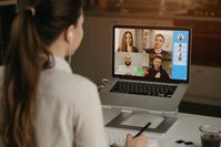 Premium Photo | A rearview of a businesswoman at home in a video conference with her colleagues during an online meeting. partners in a video call. multiethnic business team having a discussion in an online meeting.