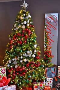 16 Amazing Christmas Tree Decorating Ideas. I love the mirror with Christmas spelled out on it. I would maybe use a chalkboard too.