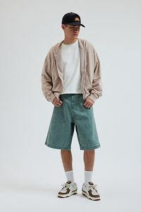 Oversized BDG baggy jorts in premium BDG denim. Longline denim shorts with a relaxed fit and zip fly. Urban Outfitters exclusive. Features BDG Astro baggy denim jorts Longline denim shorts Mid rise waist Rigid BDG denim Loose longline fit 5-pocket; zip fly UO exclusive Content + Care 100% Cotton Machine wash Imported Size + Fit Model in Dark Green 6'1.5" and wearing size 32 Measurements taken from size 32 Rise: 14" Inseam: 11.5" Leg opening: 12.5" | BDG Astro Baggy Denim Jort in Chartreuse, Men'