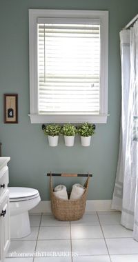 In this bathroom renovation project, Sonya of @withthebarkers completely transforms an outdated bathroom to a relaxing and modern space with a fresh coat of Green Trellis. She replaces old decor with earthy plants along the window sill and a soft white shower curtain.