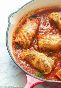 Stuffed Cabbage Rolls - cabbage leaves stuffed with rice and ground pork with a tangy and spicy tomato based sauce seasoned with herbs and spices. A great make-ahead weeknight meal or for special gathering