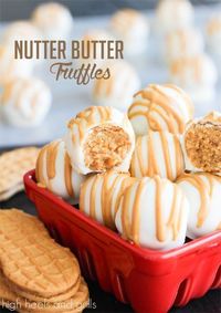 Wrap up these Four Ingredient NUTTER BUTTER Truffles for the perfect Christmas gift. Use a food processor to blend into crumbs, then mix with cream cheese and form into balls. Dip in chocolate and drizzle with peanut butter. Can you say, "easy"?