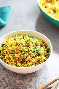 This Curry Fried Rice is packed full of flavor. Easy to make and gluten free. Use other cooked grains, spice blends for variation.  1 Pot 20 Mins. A perfect side or a light meal. #vegan #Glutenfree #Soyfree #Nutfree #Recipe #veganricha