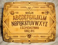 👻Discover the magic in your kitchen with our exclusive Ouija cutting board--where culinary creativity meets the supernatural! 💀 Completely redesigned with a unique Art Deco twist on the classic pattern, we've precision laser engraved this masterpiece onto your choice of 14x11" or 8x5.5" premium Farberware bamboo cutting boards.  Safe for actual use, the blank backside ensures you can chop away without damaging the front artwork. 🔪 This board makes a great conversation piece for the kitchen, b