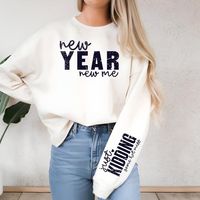 Start the year with a laugh in this fun and stylish "New Year New Me" shirt! Featuring a playful front design and cheeky sleeve detail that reads "Just Kidding, Same Hot Mess," this shirt is perfect for embracing your humor and personality as you head into the new year. Features: Material: Crafted from a medium-heavy fabric blend (50% cotton, 50% polyester) for a soft, warm feel. Design: Classic unisex fit with a crew neckline, perfect for any occasion. Durability: Ribbed knit collar and double-needle stitching ensure long-lasting wear. Comfort: No side seams and a tear-away label for a smooth, itch-free experience. Eco-Friendly: Made with ethically grown U.S. cotton and sustainable, low-impact dyes. Ideal for New Year's parties or cozy winter days, this sweatshirt combines style and comfo